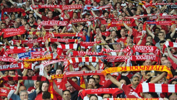 Liverpool fans holding up scarves