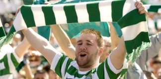 Paddy Power crowns Celtic champions after just one game Celtic fan holding a green and white scarf over his head