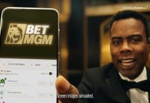 Chris Rock returns for latest BetMGM UK ad campaign Chris Rock holds up a phone with the BetMGM logo on