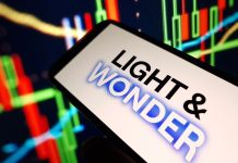Light & Wonder ongoing lawsuit ‘disruption’ set to impact Q4 figures Light & Wonder logo on phone