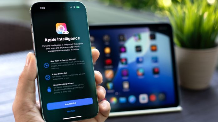 Apple Intelligence logo on phone in front of laptop