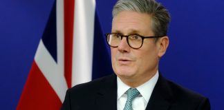 UK PM sets out plan to ‘turbocharge’ AI growth Keir Starmer in front of Union Flag
