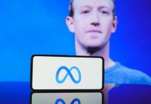 Meta, Microsoft defend AI spending amid DeepSeek revelations Mark Zuckerberg with Meta logo on phone in front of him