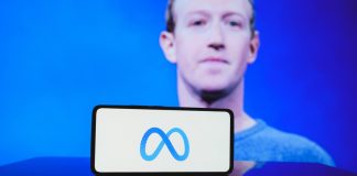 Meta, Microsoft defend AI spending amid DeepSeek revelations Mark Zuckerberg with Meta logo on phone in front of him